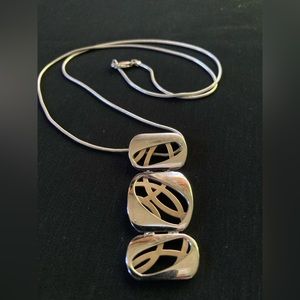 Contemporary Silver pendant on silver chain